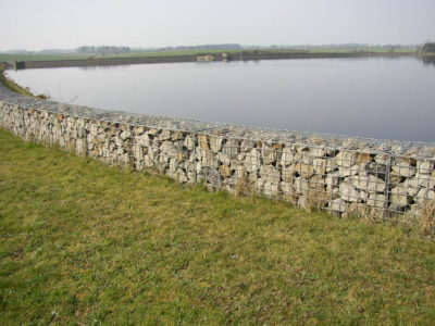 A Gabion wall is used to retain ground at a river bank
